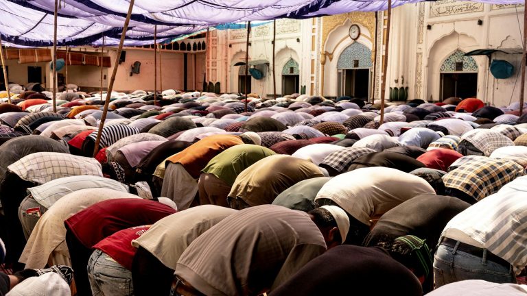 large gathering of people in outdoor prayer