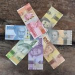 banknotes on the wooden surface