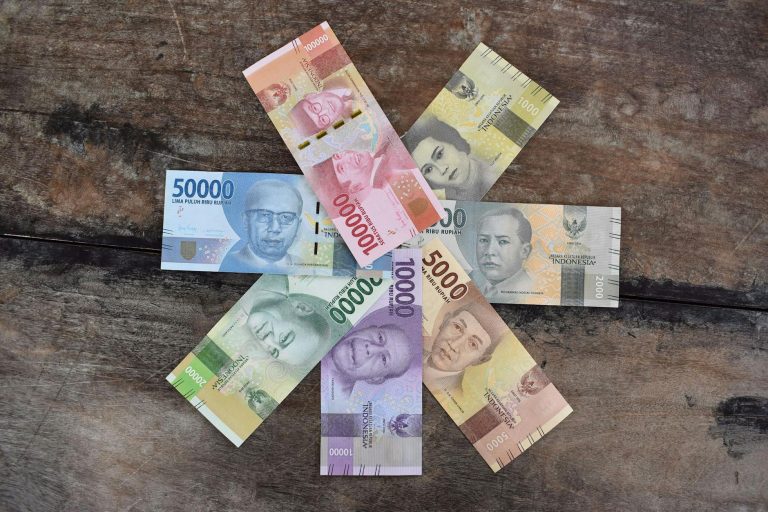 banknotes on the wooden surface