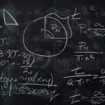 blackboard with handwritten calculations