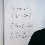 photo of math equations written on whiteboard