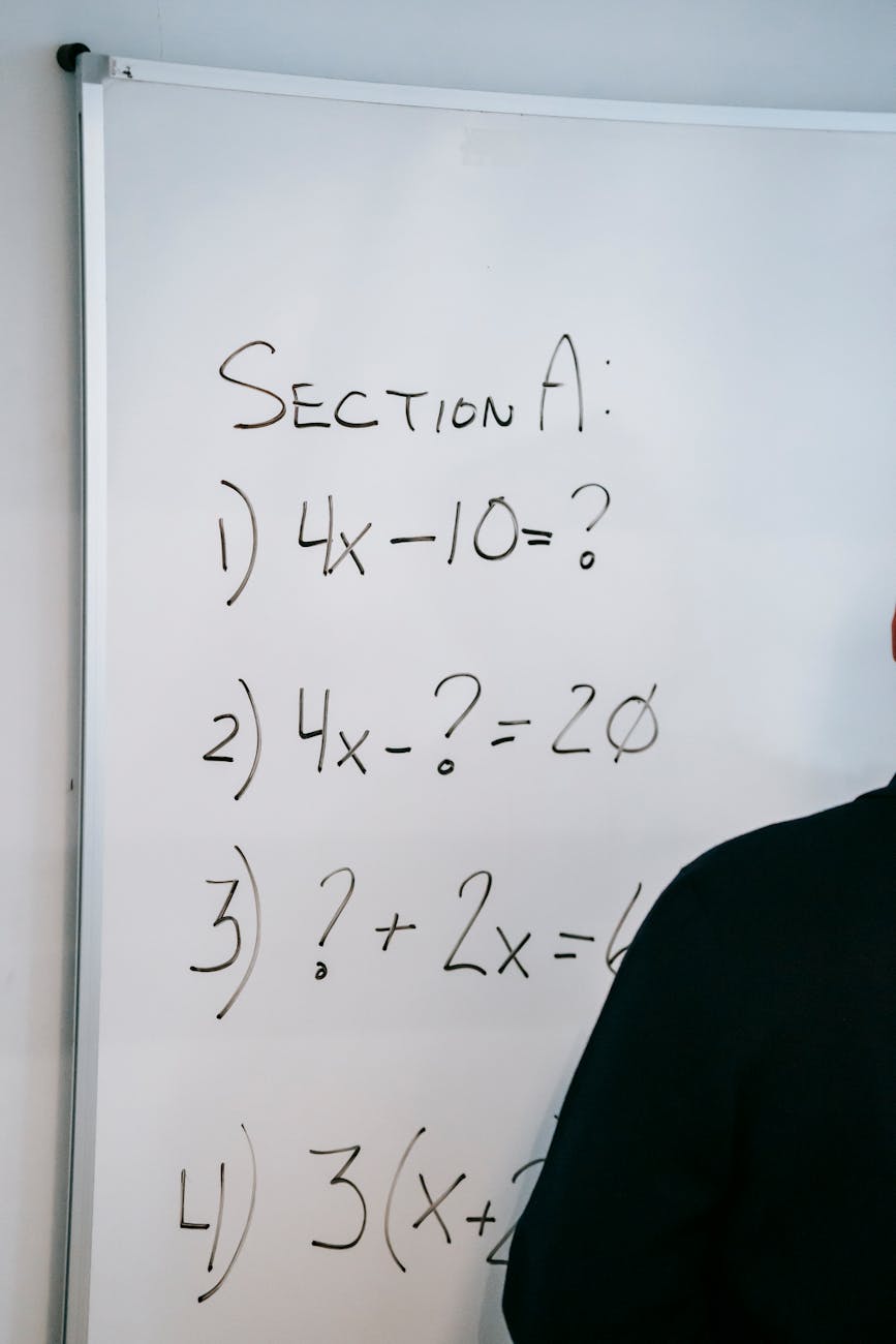 photo of math equations written on whiteboard